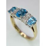 A 9K Yellow Gold Diamond and London Blue Topaz Ring. Size J, 2.1g total weight. Ref: 8410