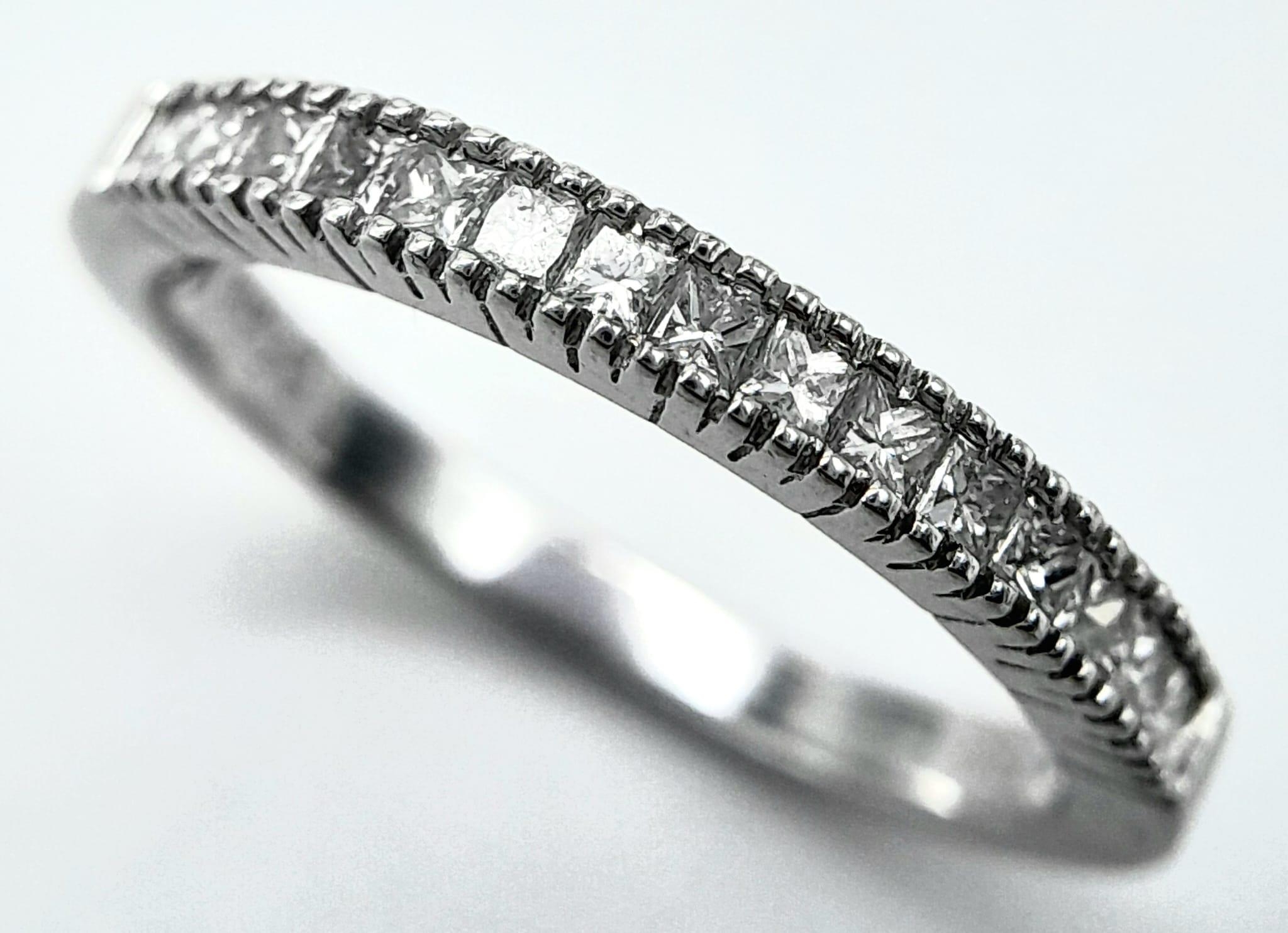 AN 18K WHITE GOLD DIAMOND SET BAND RING - PRINCESS CUTS. 0.50CTW. 2.8G. SIZE P 1/2. - Image 3 of 6