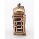 A 9K GOLD TELEPHONE BOX CHARM . 7.1gms