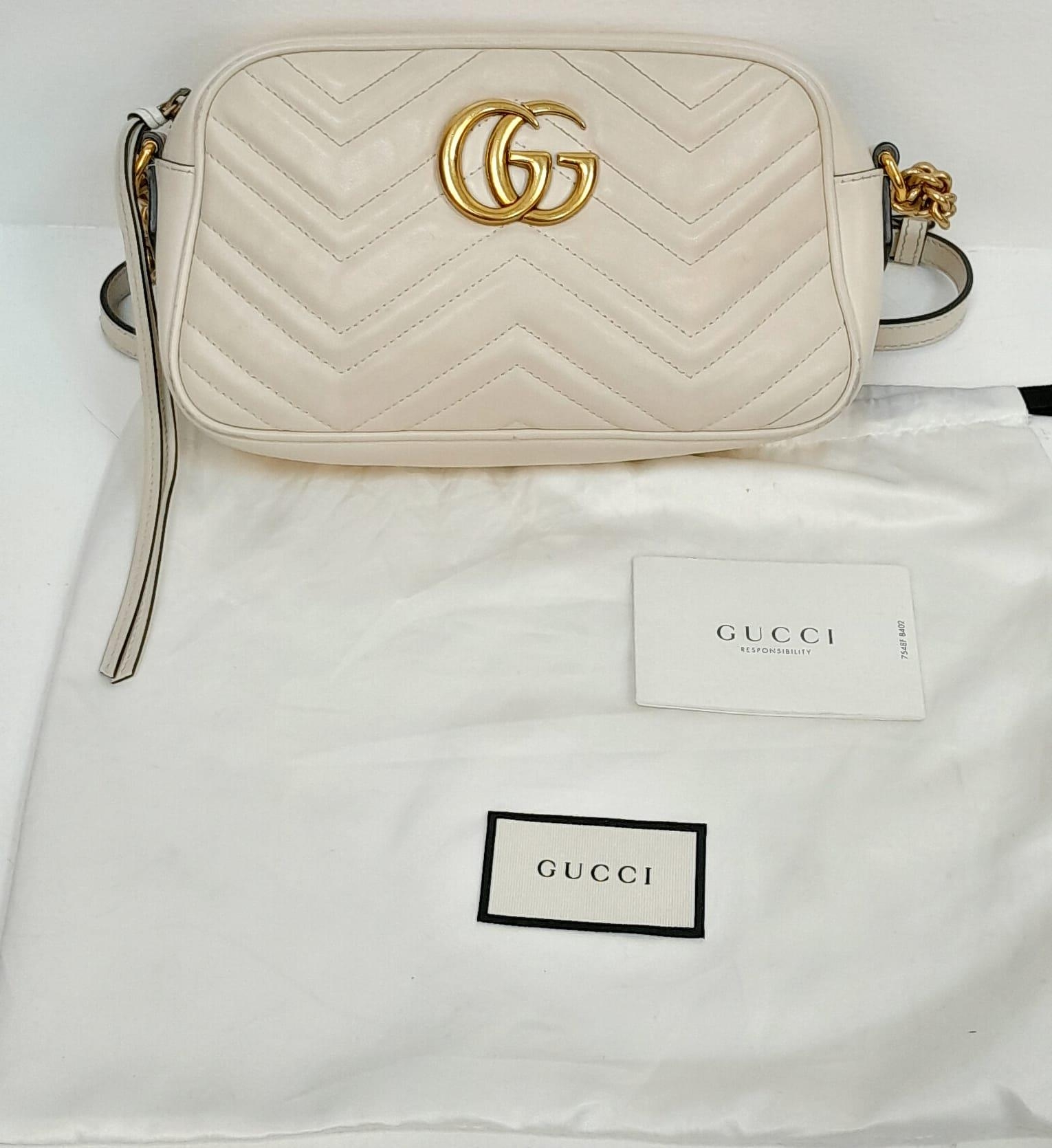 A Gucci Ivory GG Marmont Cross Body Bag. Quilted leather exterior with gold-toned hardware, chain - Image 7 of 10