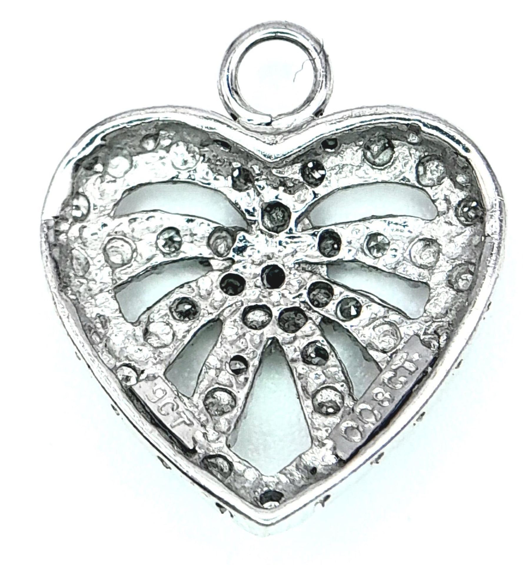 A 9K White Gold Diamond Set Heart Pendant/Charm. 1.7cm length, 1.3g total weight. Ref: 8413 - Image 2 of 7