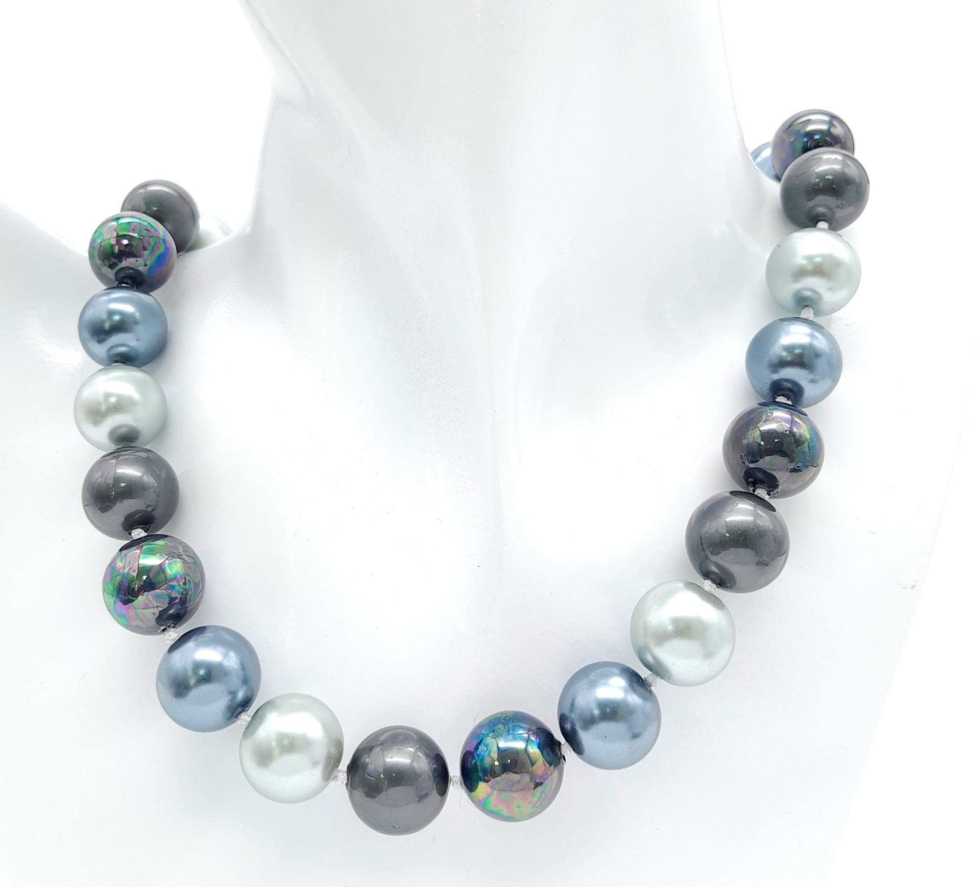 A Vibrant Metallic Shades of Grey South Sea Pearl Shell Necklace. 14mm beads. 42cm necklace length.