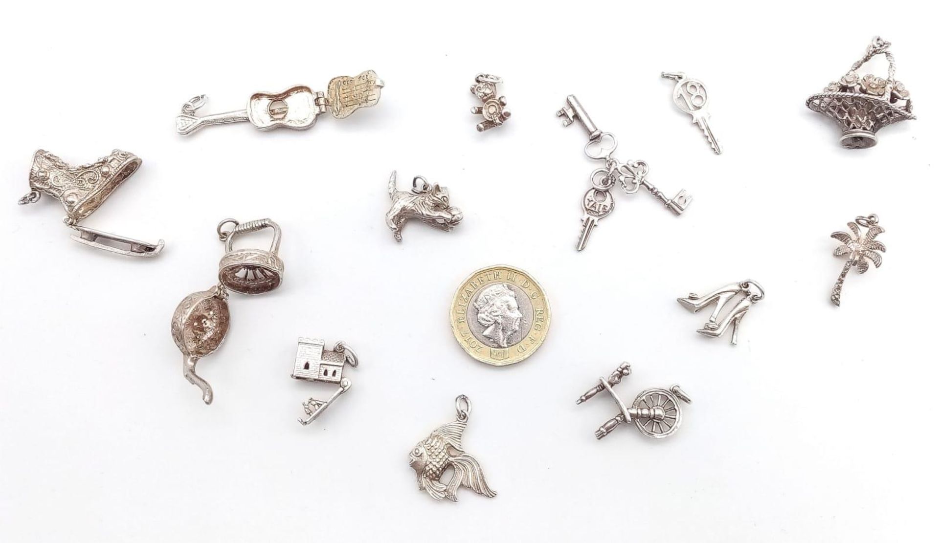 A collection of vintage silver charms/pendants such as a cat, castle, etc. Total weight 43.4G. - Image 2 of 3