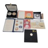 A collection of commemorative coins in proof or uncirculated condition to include "D day beach