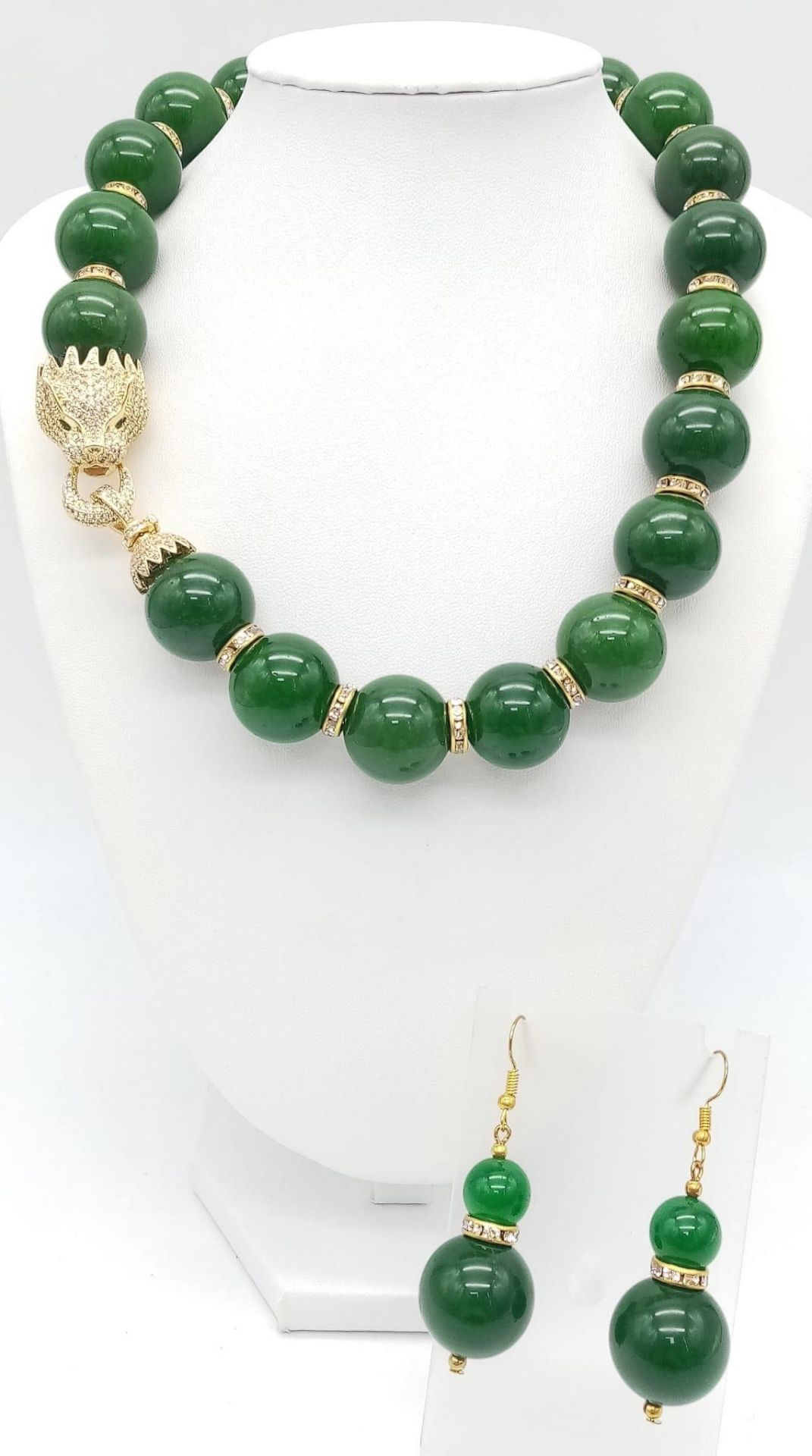 An excellent quality, large beaded (20 mm diameter), spinach green jade necklace and earrings set