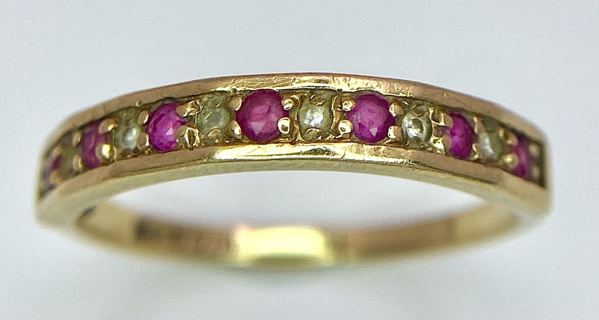 A 9K GOLD RUBY AND DIAMOND RING . 1.6gms size N - Image 2 of 11