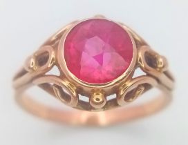 aA 14K ROSE GOLD AND RUBY RING IN REGAL STYLE . 2.4gms size L