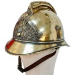 A Late 19th Century French Fireman's Brass Ornate Helmet. With original liner.