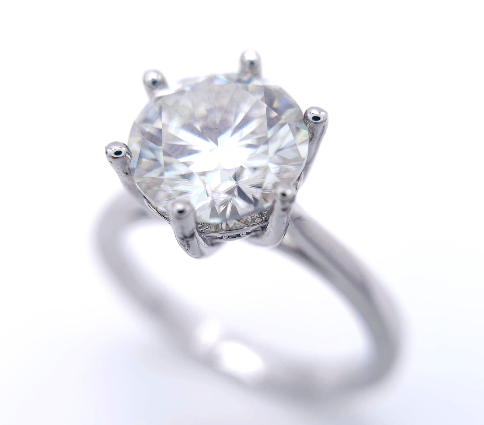 A sterling silver solitaire ring with a stunning round cut moissanite (3 carats), size: N, weight: