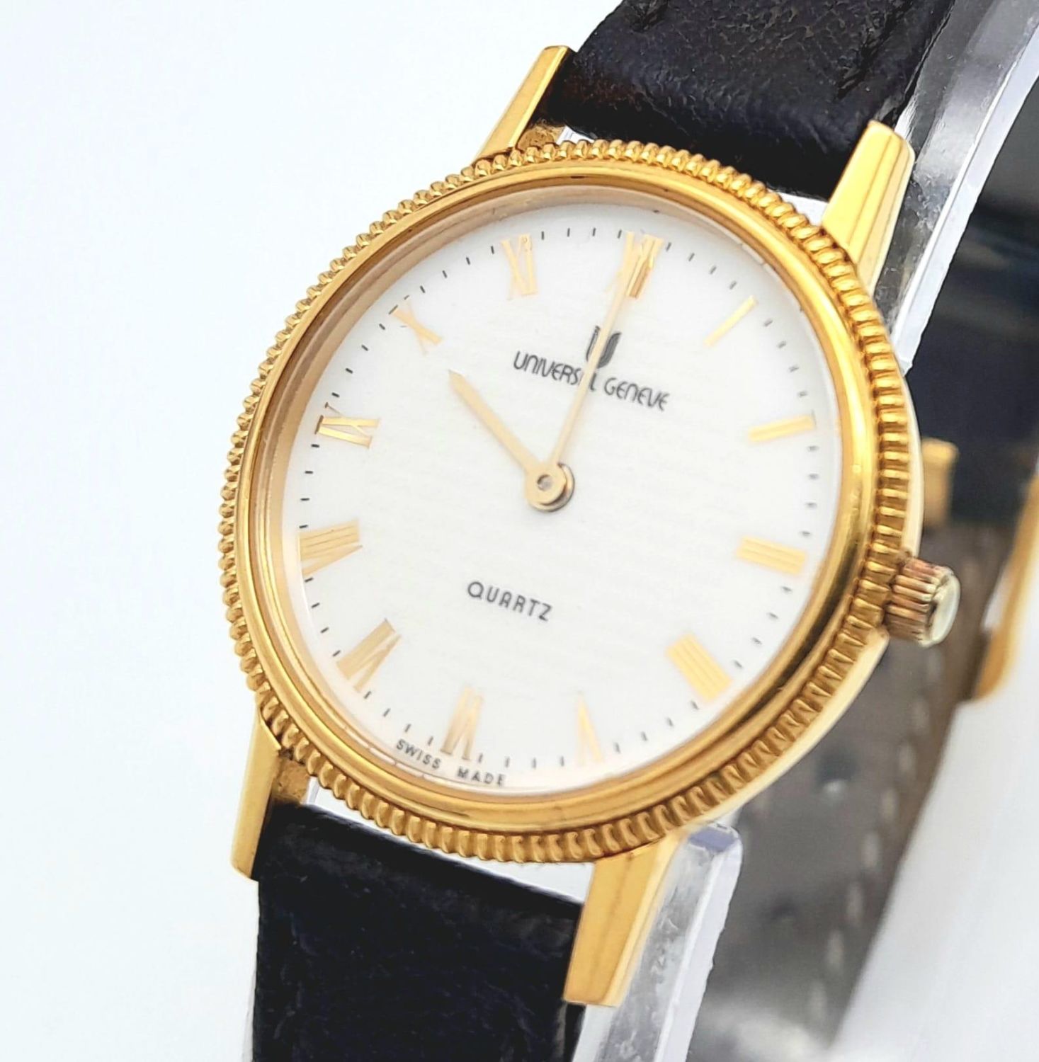 A Gold Plated Universal Quartz Ladies Watch. Black leather strap. Gold plated case - 23mm. White - Image 5 of 12