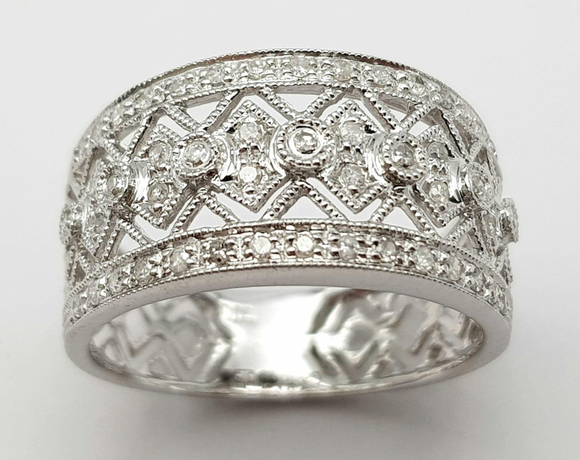 A 9K WHITE GOLD DIAMOND SET, WIDE OPEN-WORK DESIGN BAND RING. 3.3G. SIZE P. - Image 2 of 5