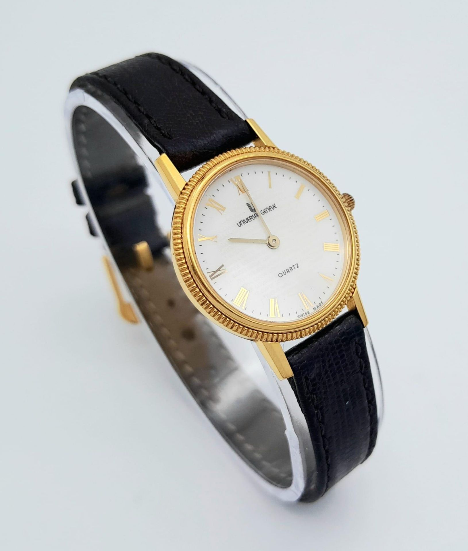 A Gold Plated Universal Quartz Ladies Watch. Black leather strap. Gold plated case - 23mm. White - Image 4 of 12