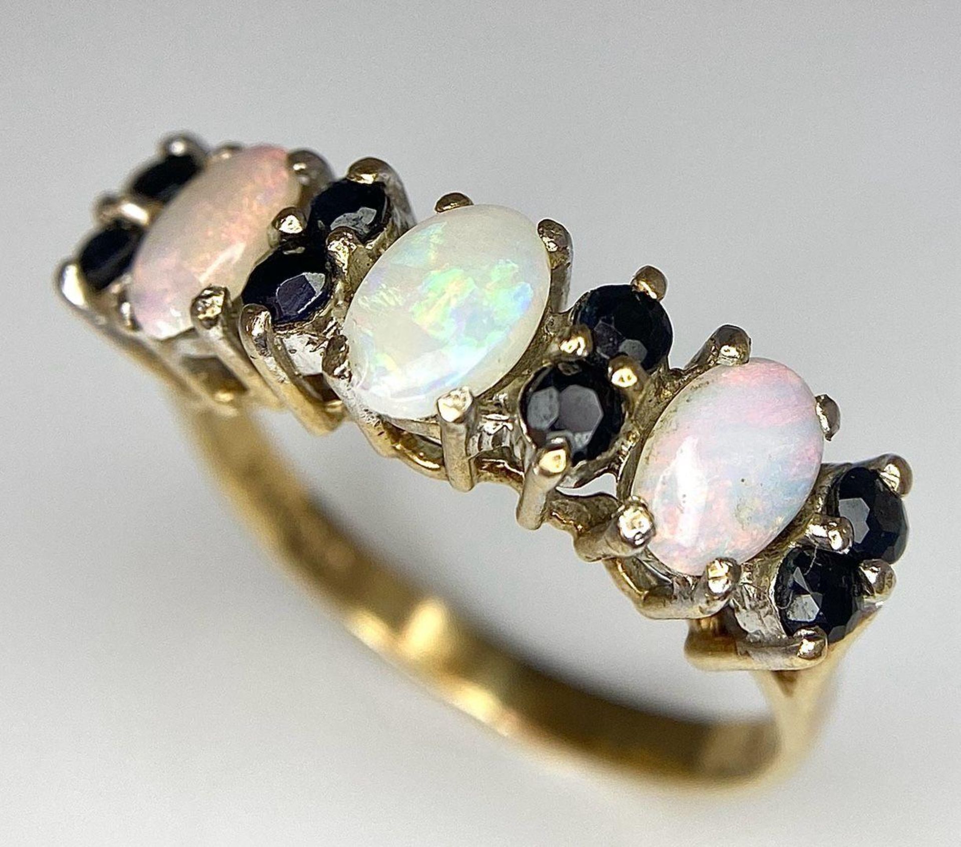 A Vintage 9K Yellow Gold Opal and Sapphire Ring. Size N. 2.7g