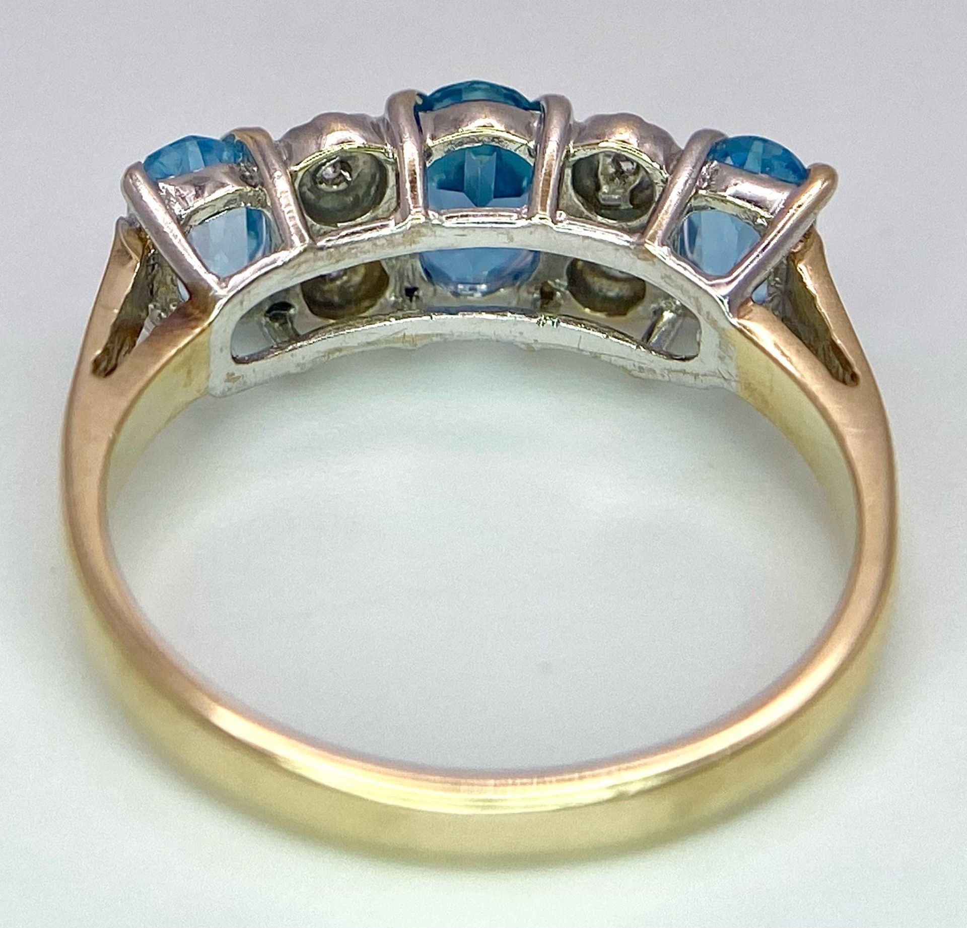 A 9K Yellow Gold Diamond and London Blue Topaz Ring. Size J, 2.1g total weight. Ref: 8410 - Image 5 of 6
