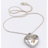 A fancy 925 silver Pawprints heart locket pendant on silver chain. Total weight 6.7G. Total length