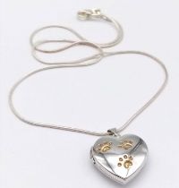 A fancy 925 silver Pawprints heart locket pendant on silver chain. Total weight 6.7G. Total length