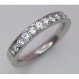 A PLATINUM AND DIAMOND BAND RING. 0.60CT. 6G. SIZE K 1/2.