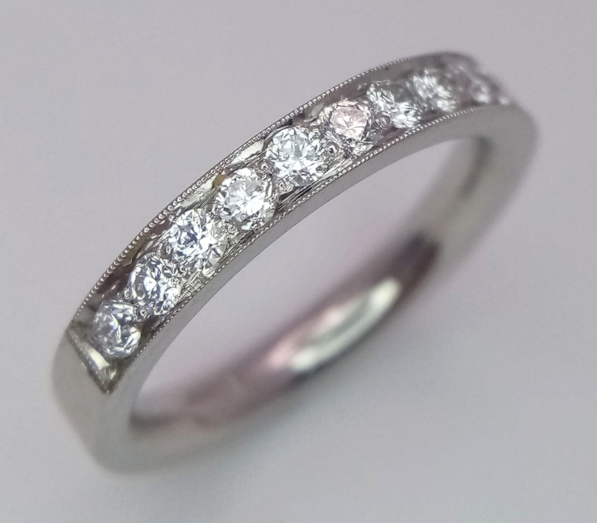 A PLATINUM AND DIAMOND BAND RING. 0.60CT. 6G. SIZE K 1/2. - Bild 2 aus 4