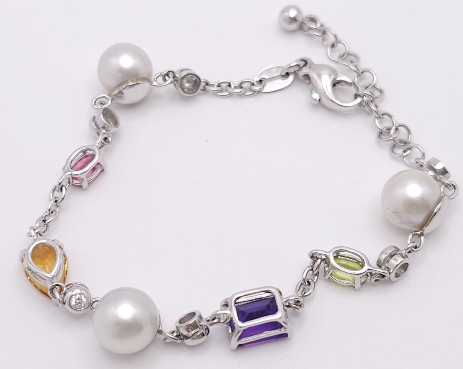 An 18 K white gold chain bracelet with a variety of gemstones (peridot, amethyst, citrine, etc) - Image 9 of 12