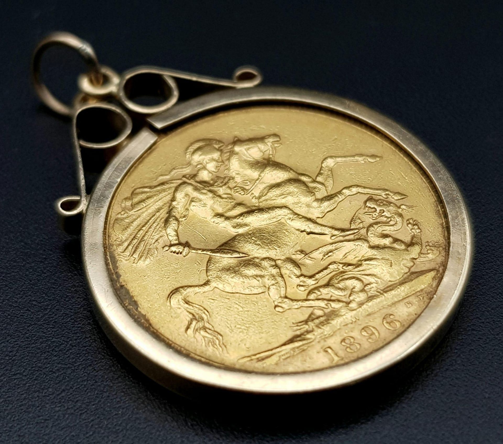 An 1896 Queen Victoria 22K Gold Full Sovereign in a 9K Gold Casing. 9.47g total weight.