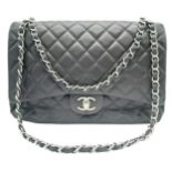 A Chanel Jumbo Double Flap Maxi Bag. Dark grey quilted caviar leather exterior with a large slip