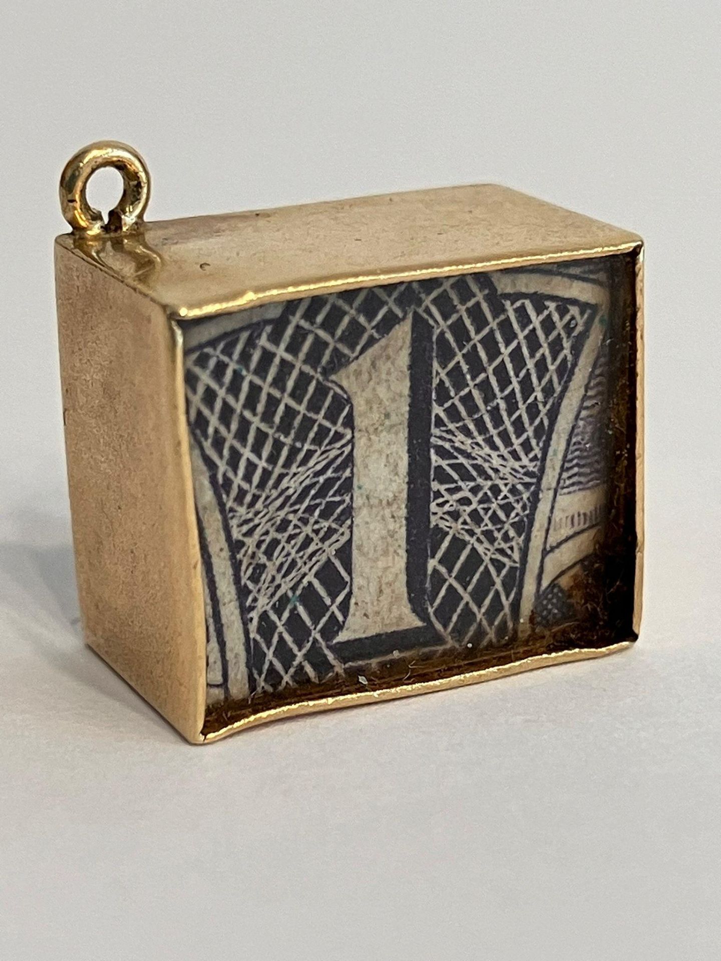 Vintage 9 carat GOLD CHARM with folded BLUE £1 NOTE inside a windowed 9 carat GOLD Case. Full UK