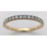 A 9K YELLOW GOLD DIAMOND HALF ETERNITY RING. 0.25CTW. 1.5G. SIZE N.