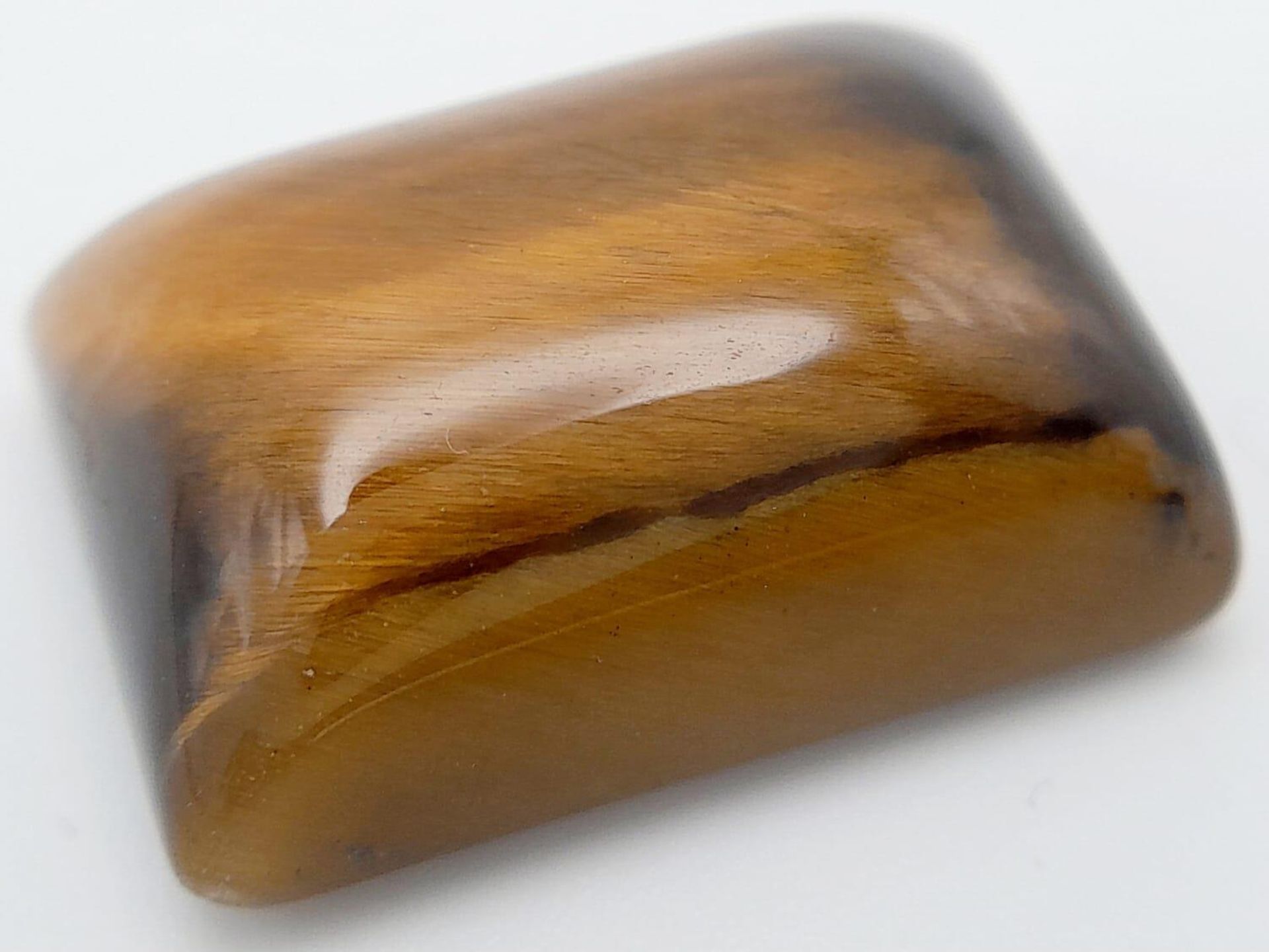 A 29.70ct Natural Tiger Eye Gemstone, in the Square Cabochon shape. Comes with the GLI