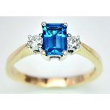 A 9K YELLOW GOLD DIAMOND & BLUE TOPAZ RING. 2.2G. SIZE M.