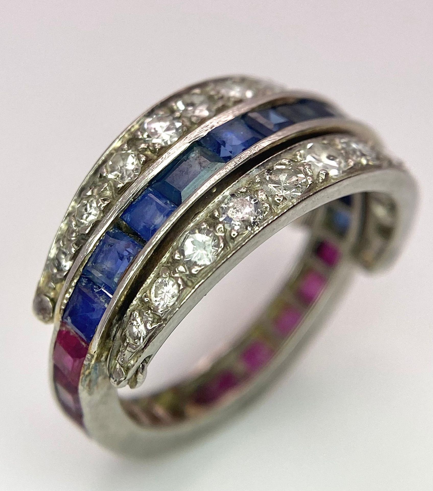 An 9k White Gold Sapphire, Diamond and Ruby Flip-Over Ring. A central band of rubies and sapphires - Image 3 of 4