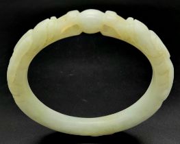 An Antique Chinese Pale Green Double Dragon Jade Bangle. 63mm inner diameter.