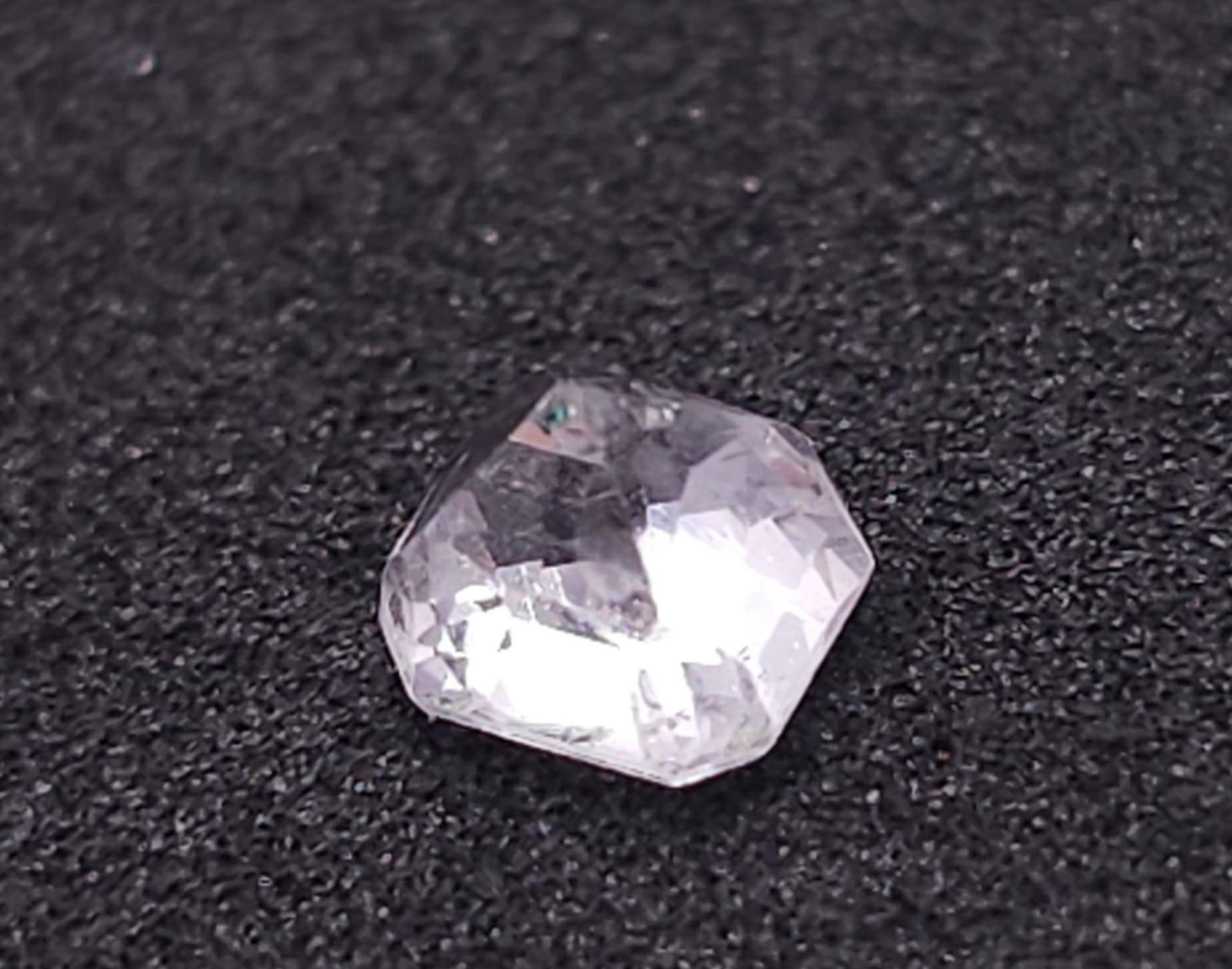 A 0.76ct Madagascar Colourless Natural Sapphire, in the Octagon Cut. Comes with the AIG Certificate. - Image 3 of 6