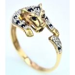 A 9K YELLOW GOLD DIAMOND & SAPPHIRE SET PANTHER RING. 3.2G. SIZE U