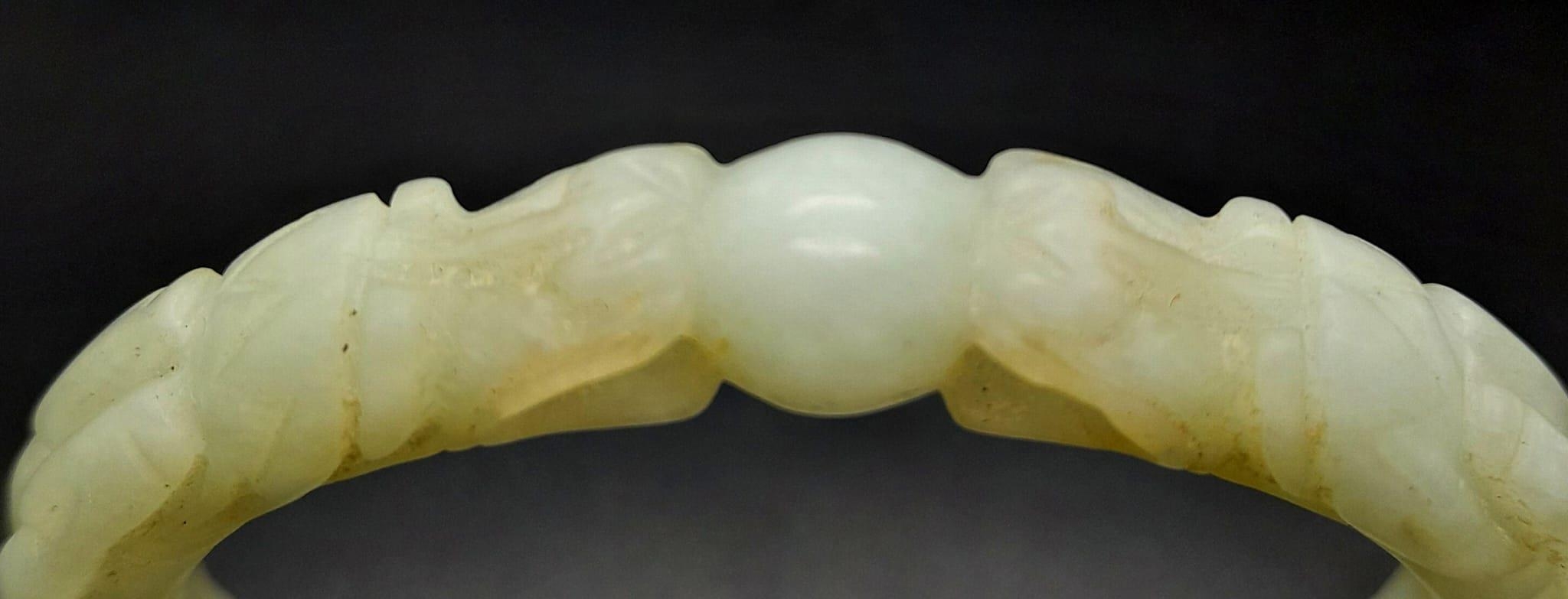 An Antique Chinese Pale Green Double Dragon Jade Bangle. 63mm inner diameter. - Image 3 of 4