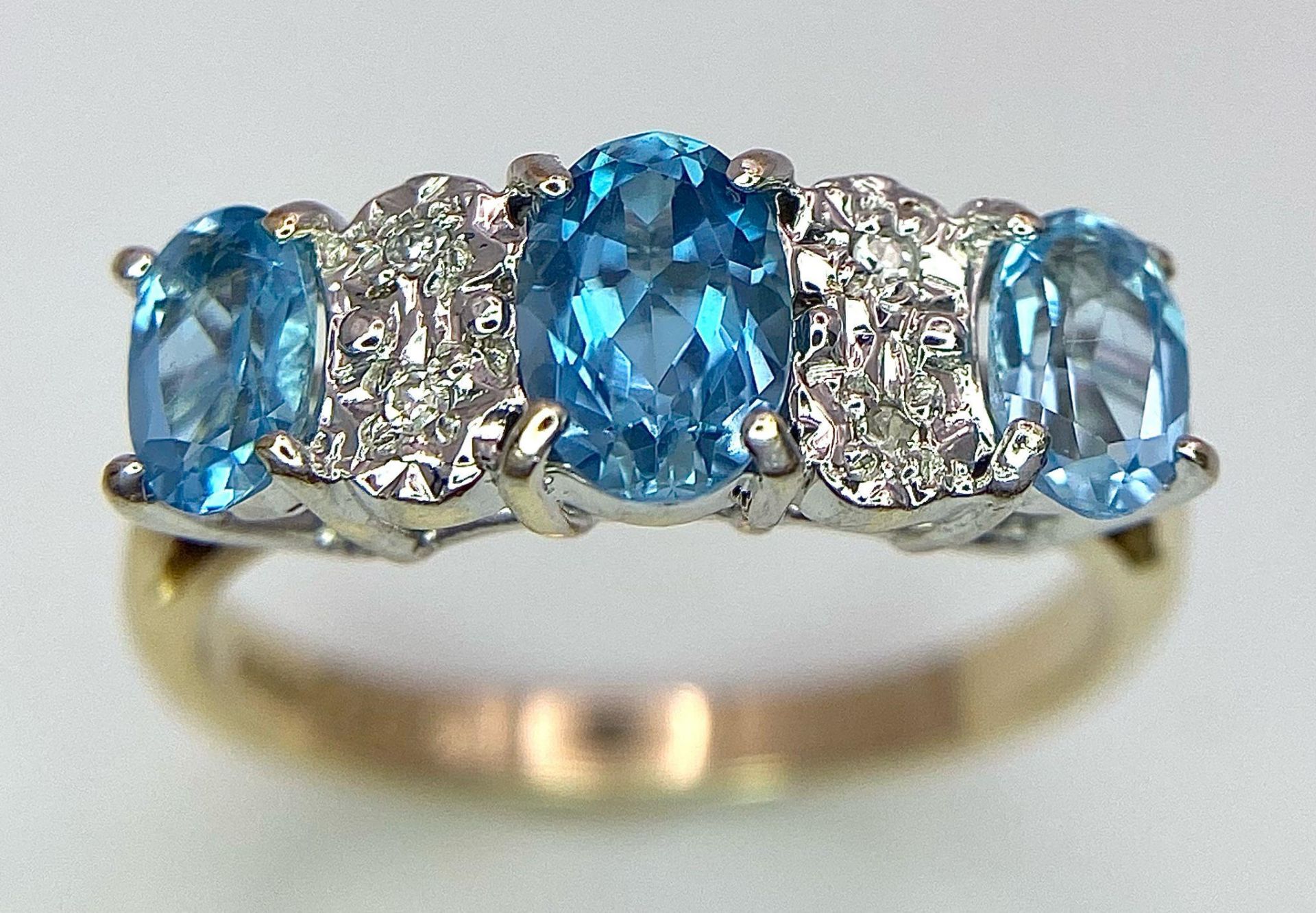 A 9K Yellow Gold Diamond and London Blue Topaz Ring. Size J, 2.1g total weight. Ref: 8410 - Image 2 of 6