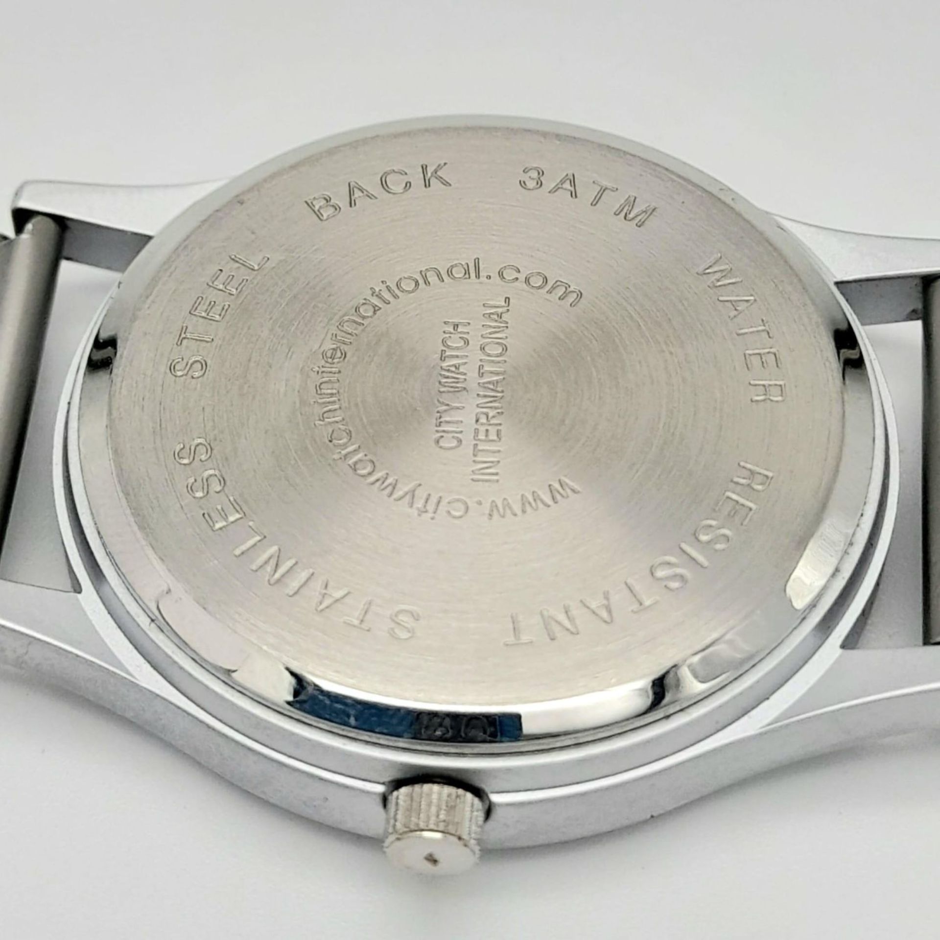 A MODERN "COBRA" BY CITY WATCH INTERNATIONAL , QUARTZ MOVEMENT ON A STAINLESS STEEL STRAP . 34mm - Image 11 of 12