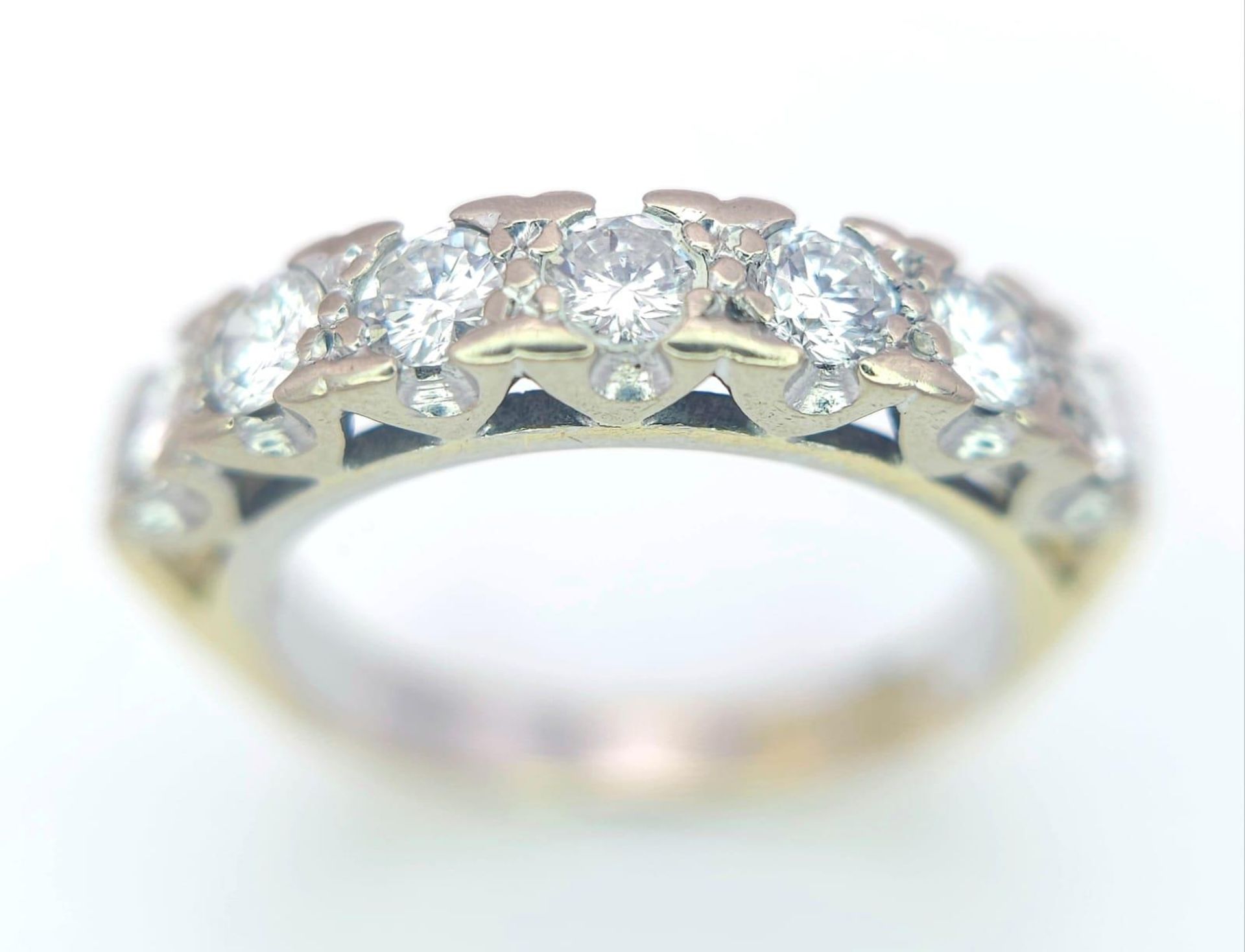 An 18K Yellow Gold Diamond Half Eternity Ring. 0.70ctw, Size J1/2, 3.6g total weight. Ref: 8451