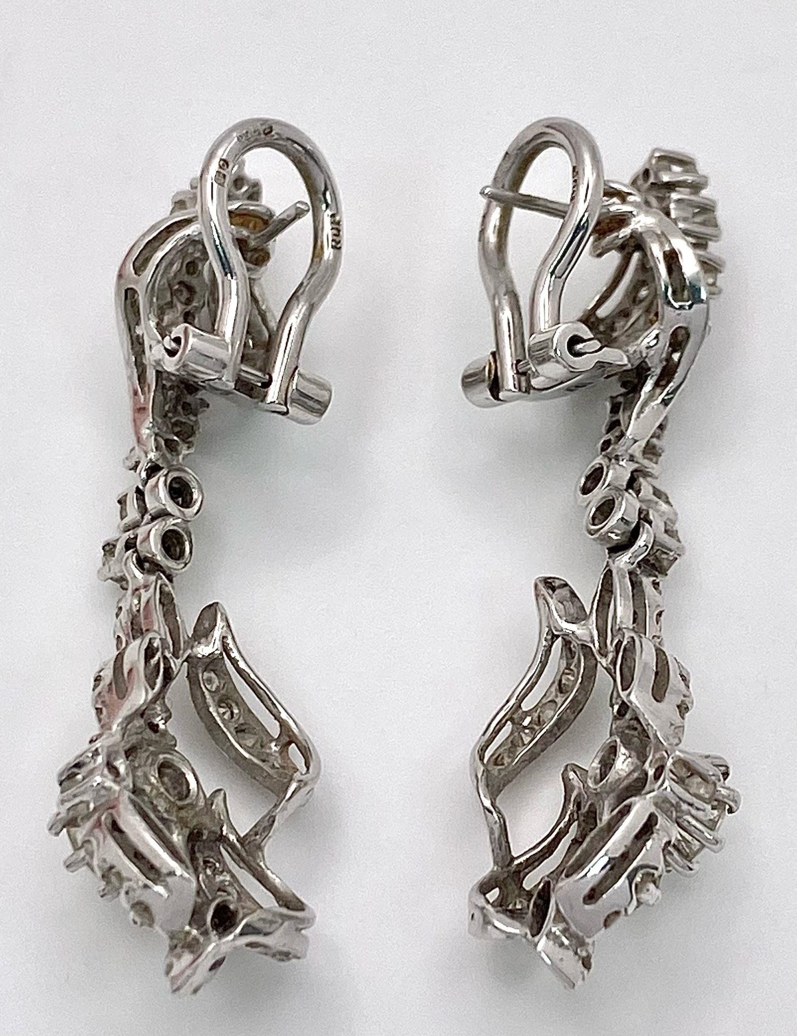 A Pair of Art Deco Style 18K White Gold and Diamond Drop Earrings. An array of round and brilliant - Image 10 of 15