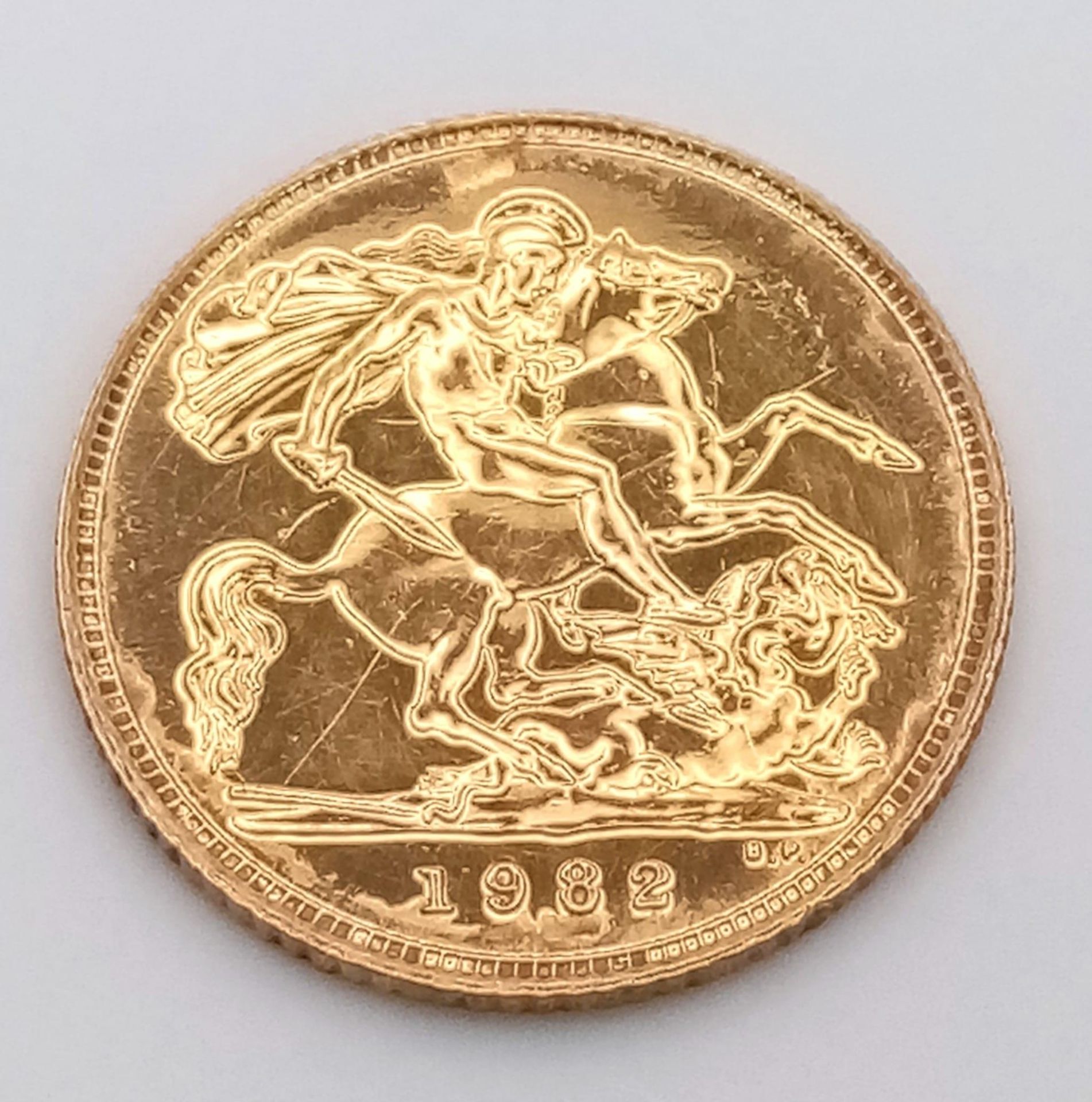 A 22K GOLD HALF SOVEREIGN DATED 1982