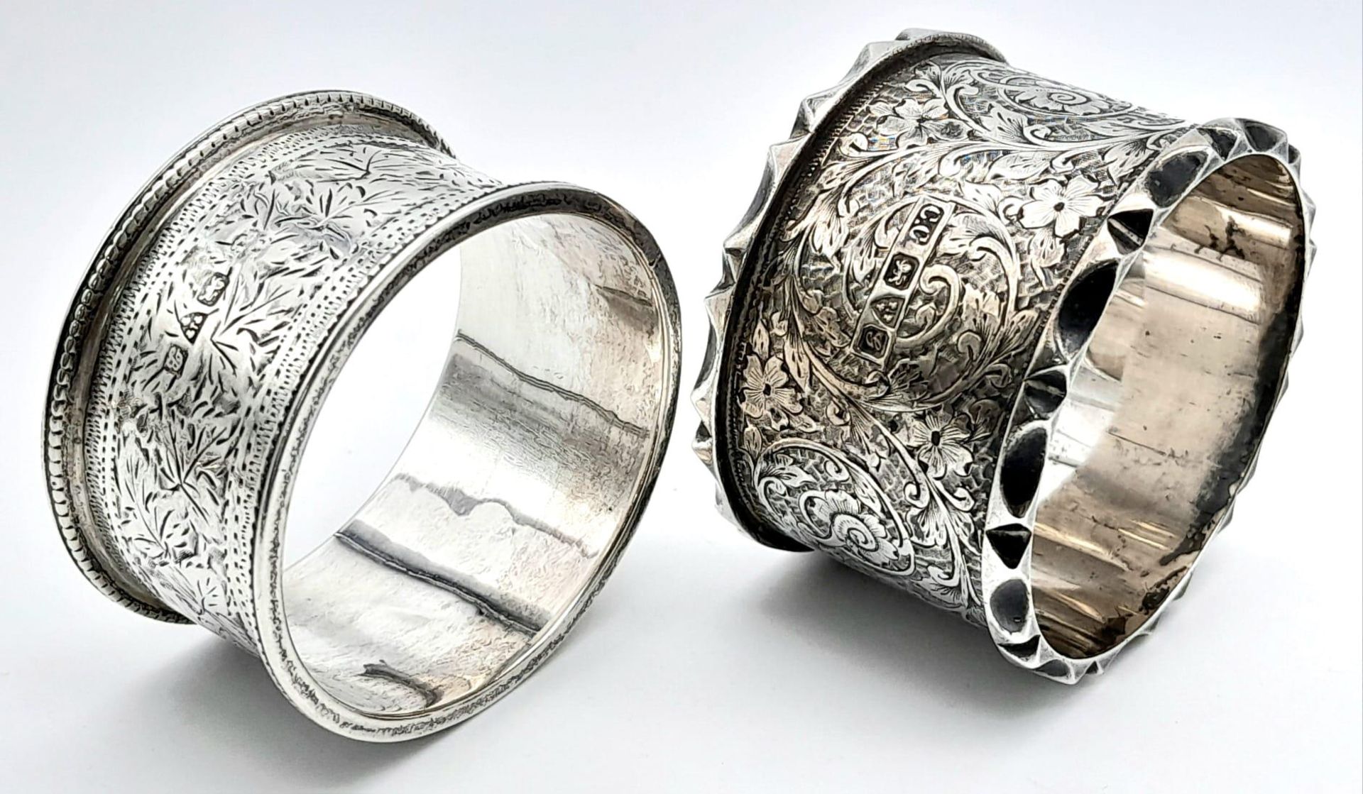 A collection of 2 antique sterling silver napkin holders with fabulous floral engravings. Come - Image 5 of 6