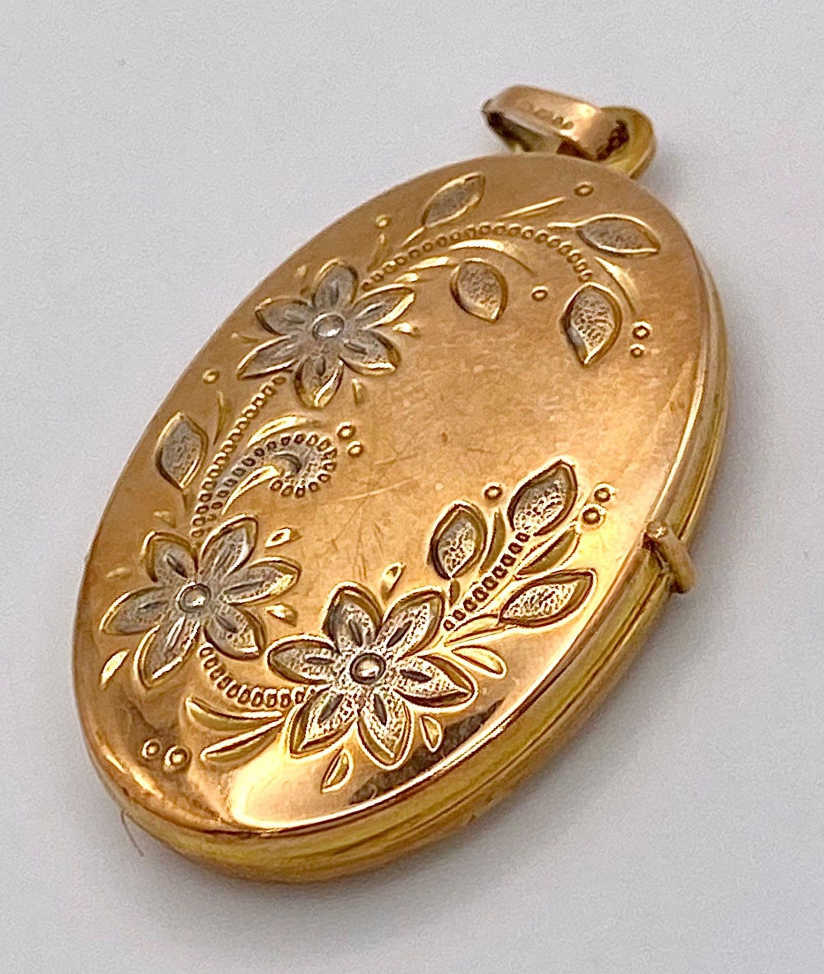 A Vintage 9K Yellow and White Gold Locket Pendant. 4.5cm. 5.1g total weight.