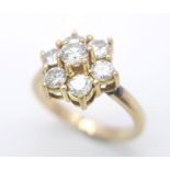 AN 18K YELLOW GOLD DIAMOND CLUSTER RING. 1.20CTW OF ROUND BRILIANT CUT DIAMONDS. 3.9G. SIZE L.