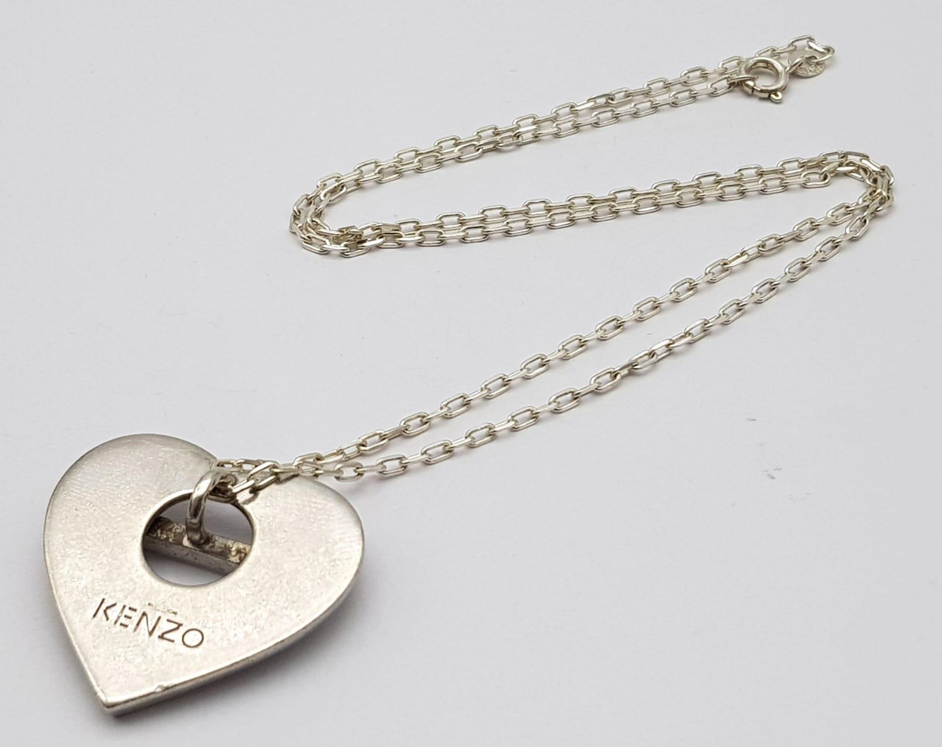 A Vintage Kenzo Heart Pendant Necklace. 50cm Length 950 Silver Chain. Pendant Measures 3.5cm Wide.