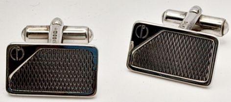 A Pair of Hallmarked 1985 Sterling Silver Cufflinks by Dunhill in their original presentation box.