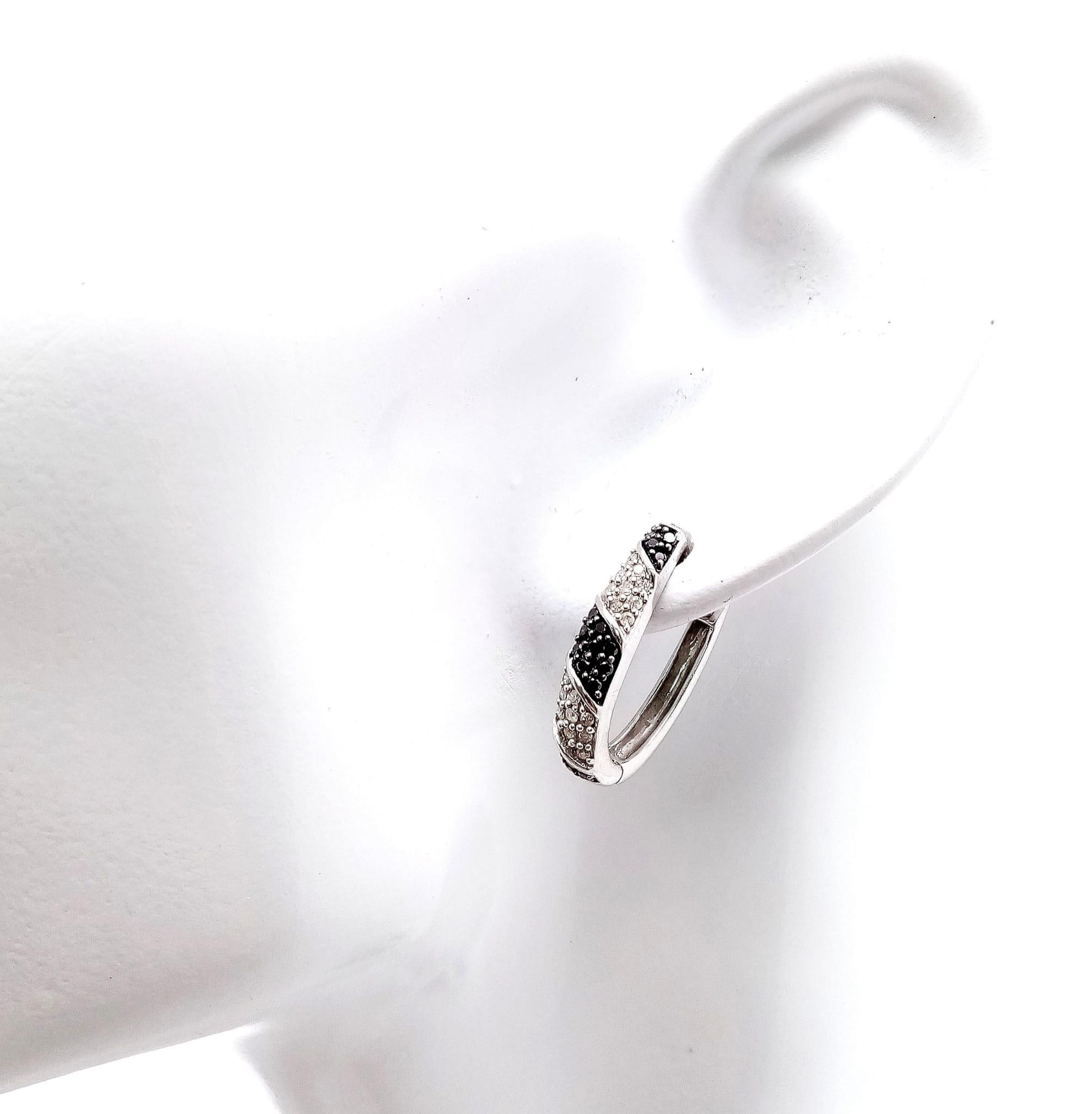 A Pair of 9K White Gold, Black & White Diamond Set Earrings. 0.40ctw, 2cm length, 5g total weight. - Image 4 of 9