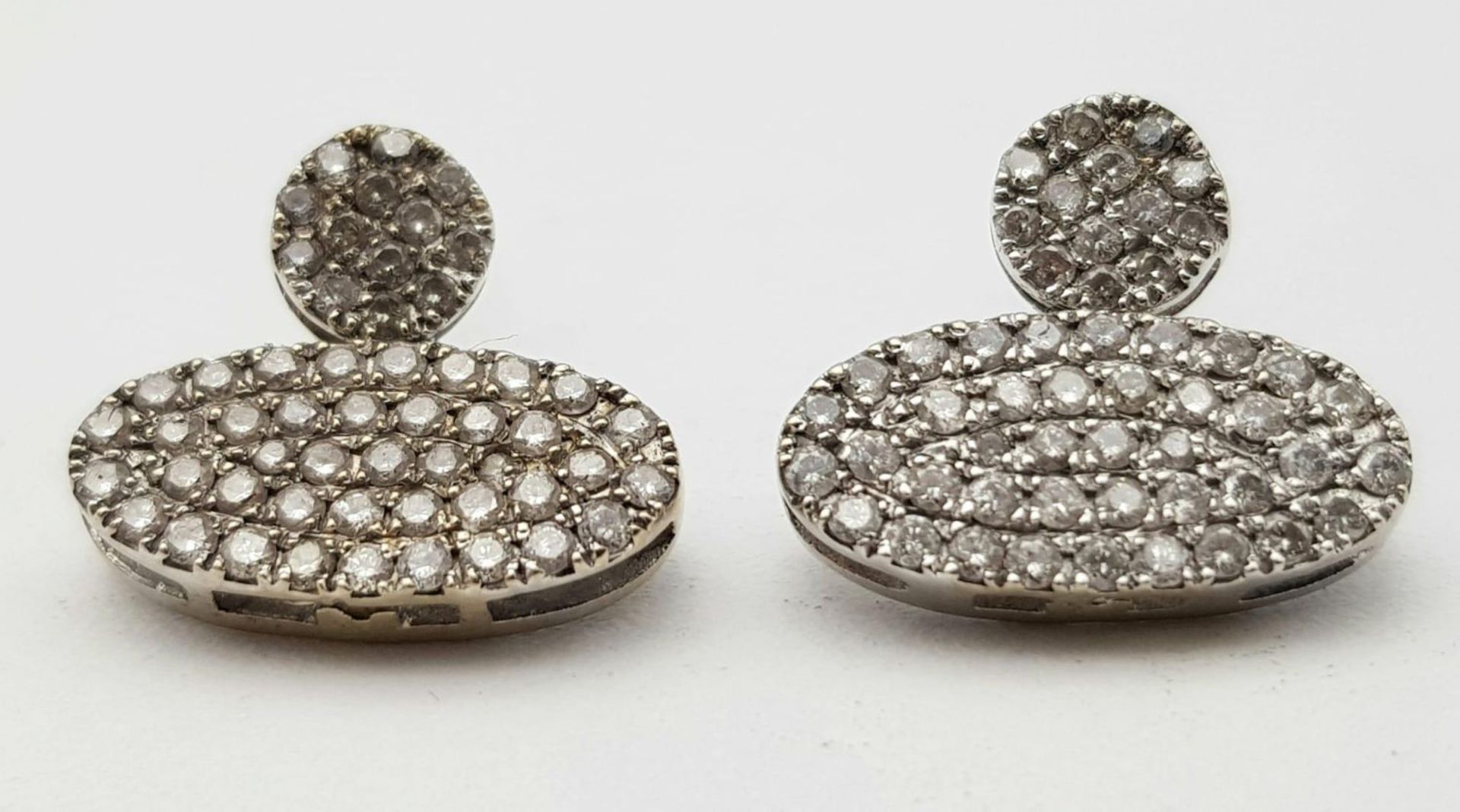 A PAIR OF DIAMOND ENCRUSTED EARRINGS SET IN PLATINUM . 2.2gms - Image 5 of 6