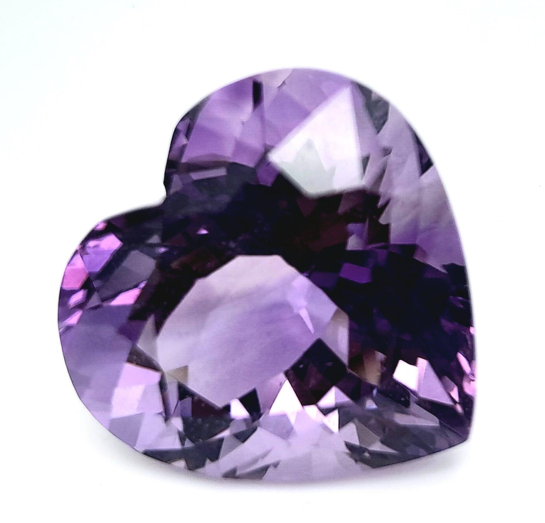 A large (30.96 carats), heart shaped mix cut, amethyst, dimensions: 20.64 x 21.31 x 14.83 mm, good