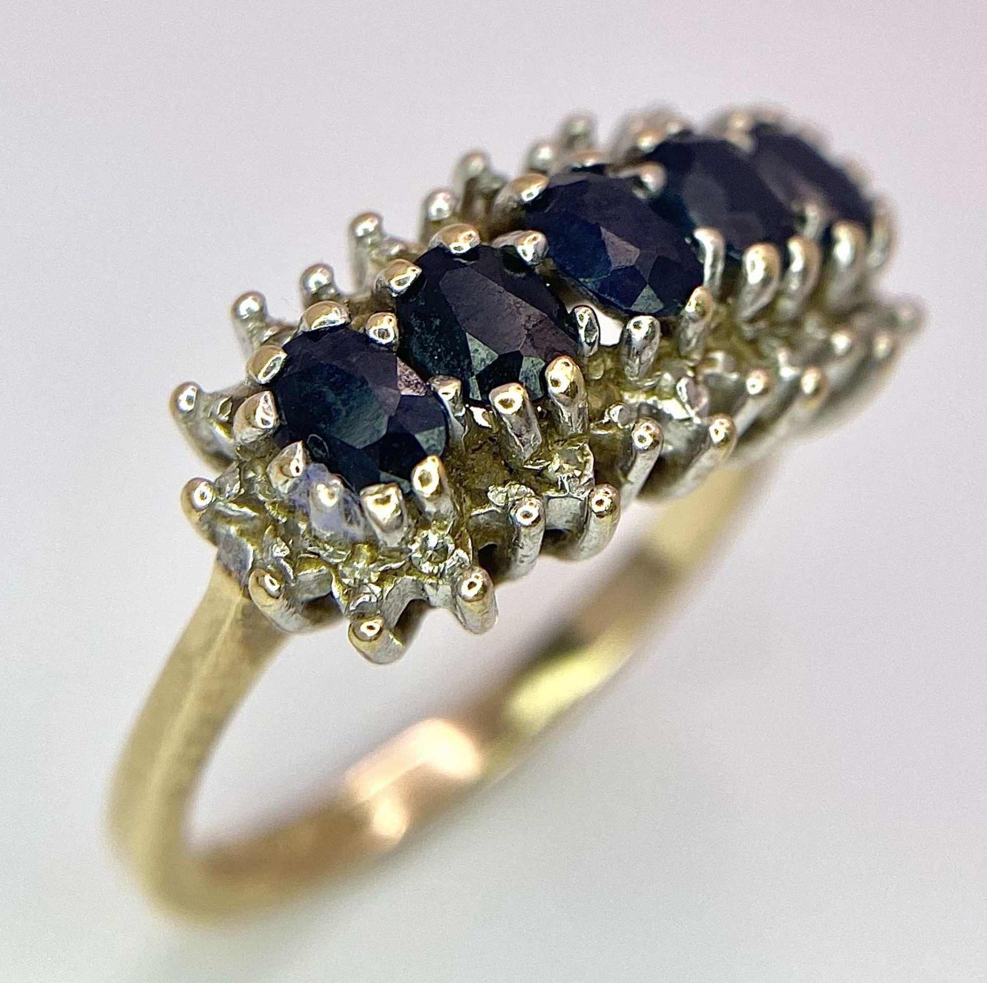 A 9K Yellow Gold Diamond and Sapphire Ring. Size M, 3.4g total weight. Ref: 8417