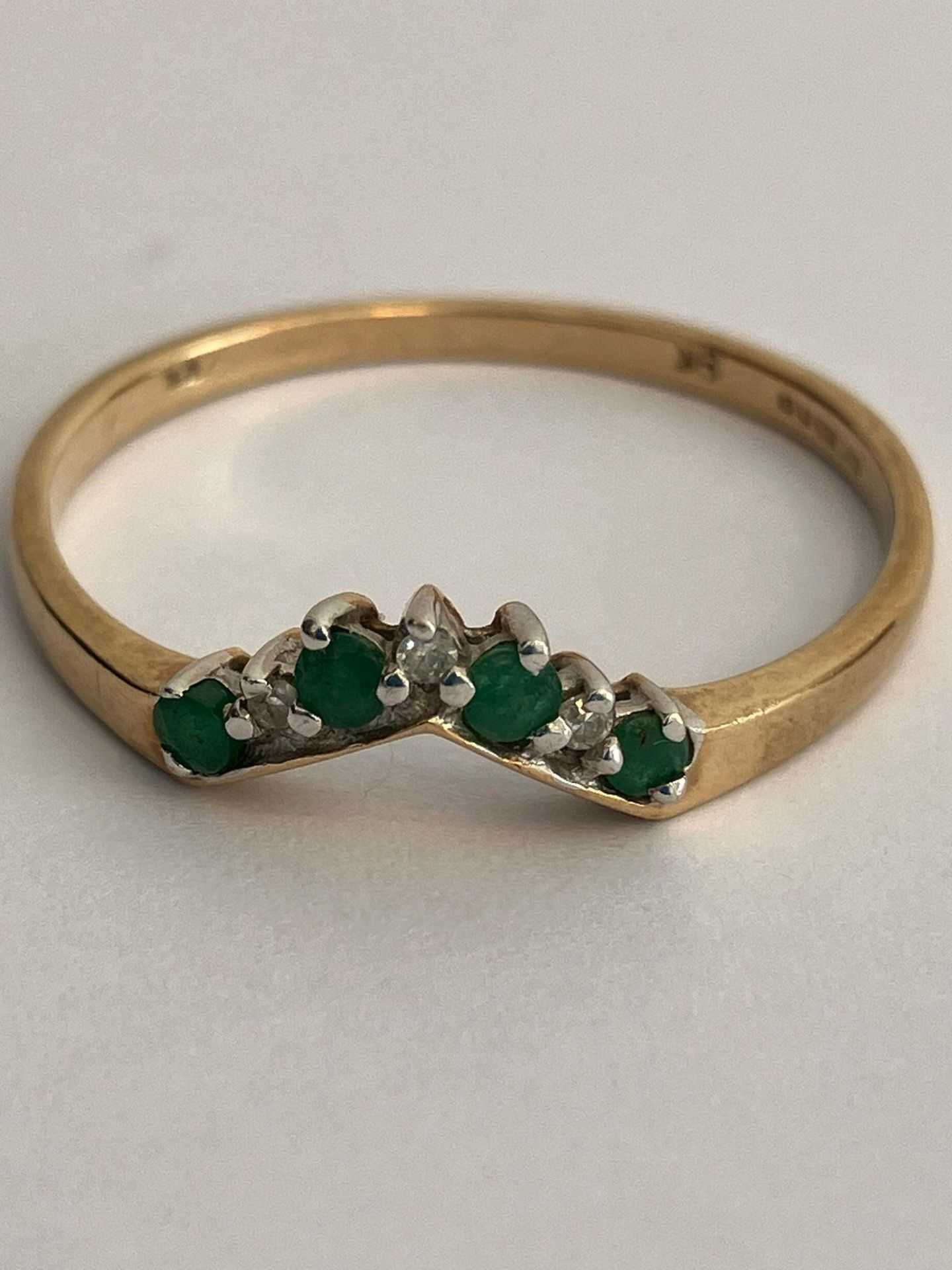 9 carat GOLD WISHBONE RING set with DIAMONDS & EMERALDS. Full UK hallmark. Complete with ring box.