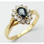 AN 18K YELLOW GOLD DIAMOND & SAPPHIRE PEAR SHAPED CLUSTER RING. 3.2G. SIZE R.